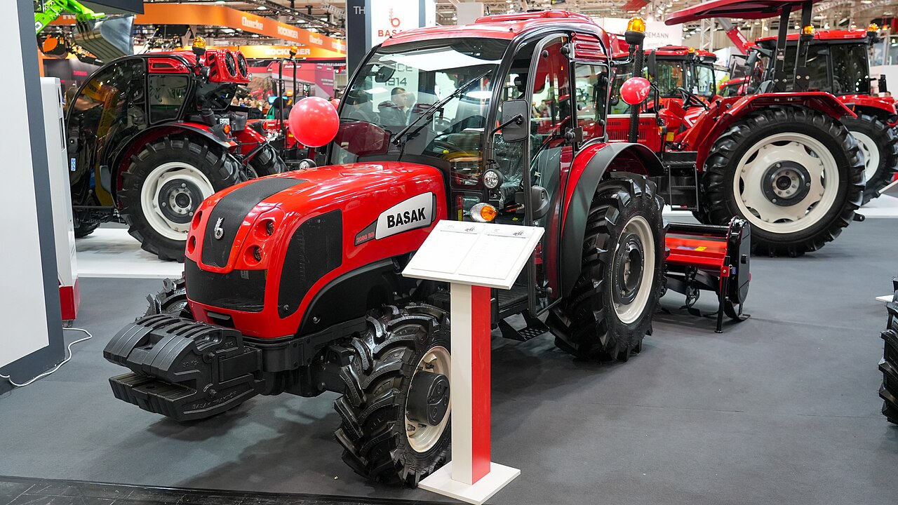 Red agricultural tractor at exhibition