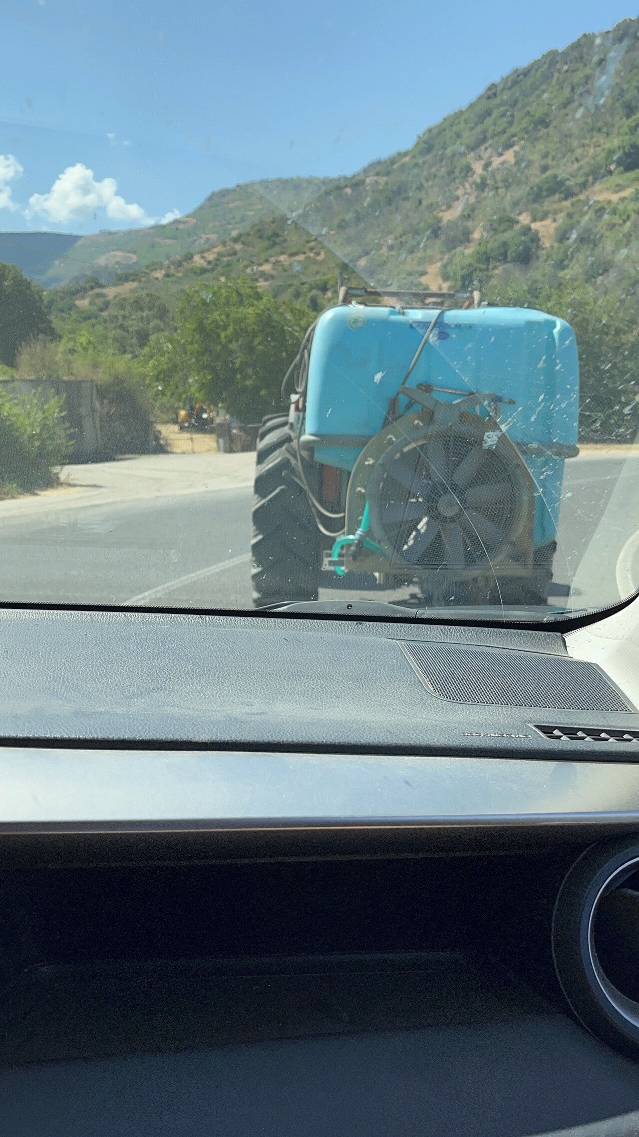 tractor spraying hazelnut orchard